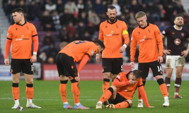 A devastated Pawlett on the Tynecastle turf. Image: SNS