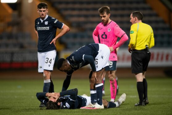 Cillian Sheridan is dejected after suffering injury against Raith Rovers. Image: SNS.