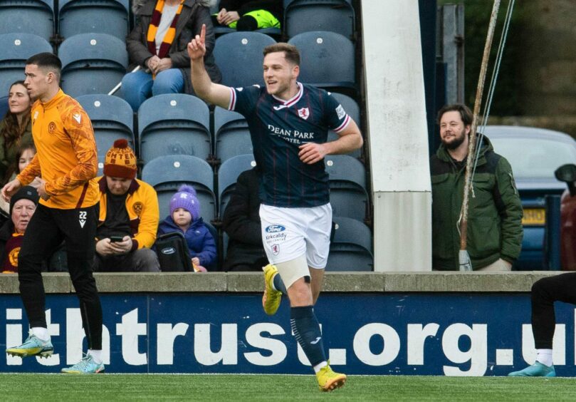 Jamie Gullan runs away with his hand in the air after netting the opening goal in last season's Scottish Cup win over Motherwell. Image: SNS.
