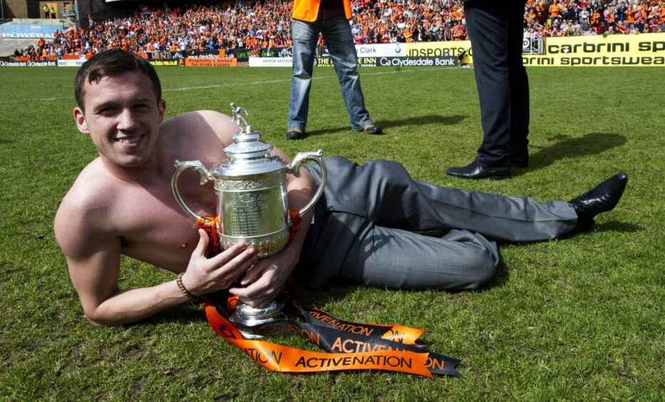 Shirtless Swanson celebrates with the Scottish Cup in 2010. Image: SNS
