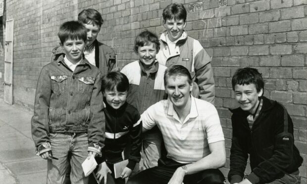 Gentle giant Billy Thomson signs autographs for young United fans