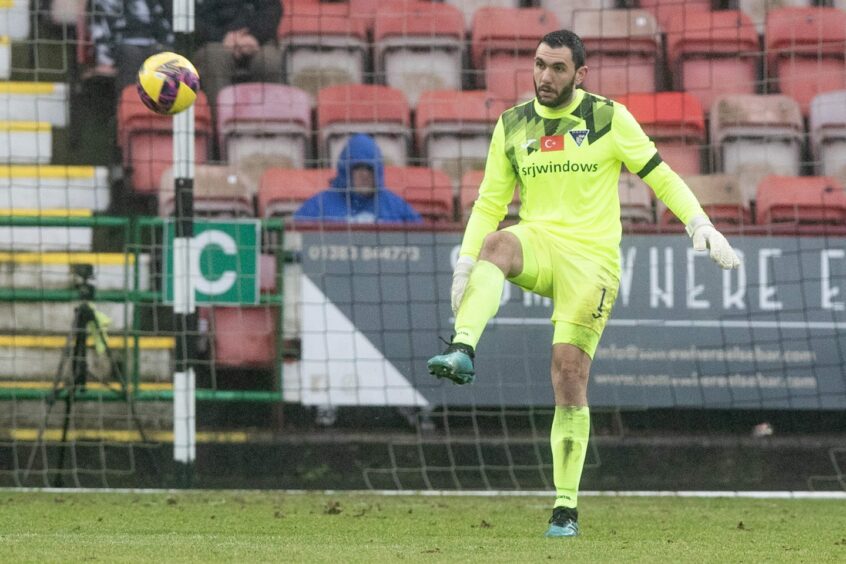 Dunfermline goalie Deniz Mehmet kicks the ball upfield
