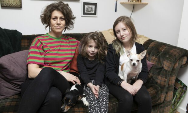 Abigail Bennett with daughters Wren and Honey, and dogs Marley and Lois.
Image: Phil Hannah