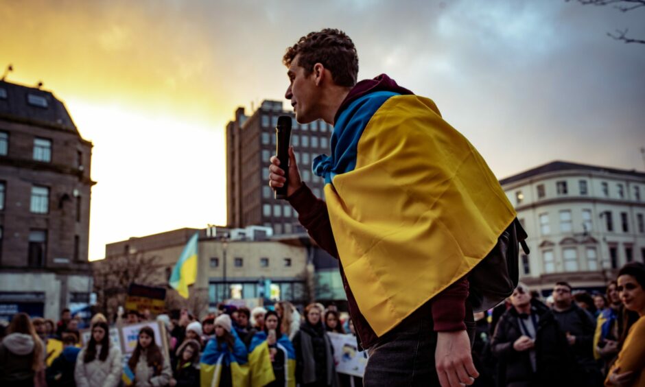 Bohdan Tierokhin leads chanting among fellow Ukrainians at a rally for their homeland held in Dundee City Square.