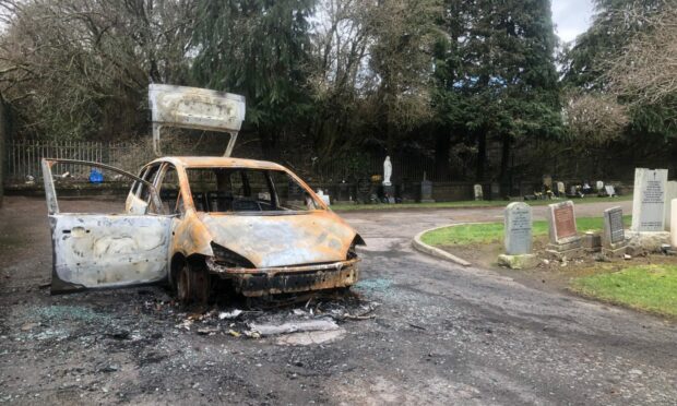 The burnt-out car in Eastern Cemetery, Dundee: James Simpson/DC Thomson