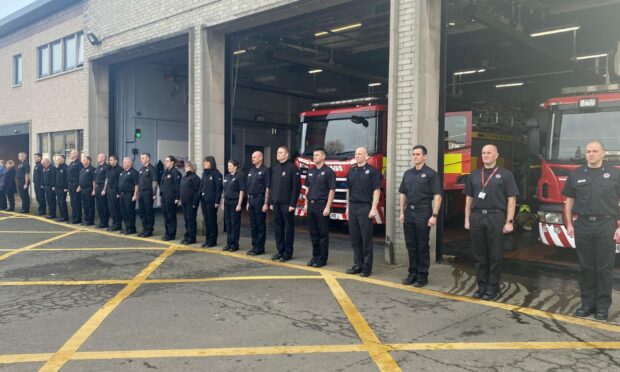 Minute's silence at Dumfries Fire Station, in memory of Barry Martin. Image: Scottish Fire and Rescue Service /PA Wire.