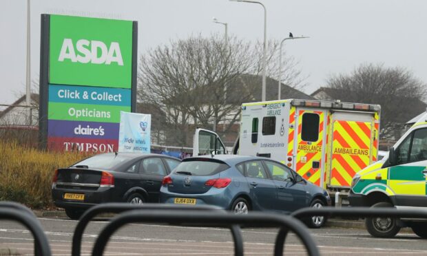 Police and ambulance at the car wash at Milton of Craigie in Dundee. Image: Gareth Jennings/DC Thomson.