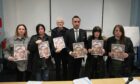 Joseph's sisters Gillian Sinclair and Kerry Sneddon, his father James Sneddon, lawyer Aamer Anwar, mother Jane Sneddon, sister Laura Sneddon and uncle James Scougall highlighting the family's case. Image G Jennings/ DC Thomson.