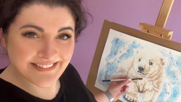 Kinross artist Victoria Gordon with one of her paintings. Image: Victoria Gordon Art.