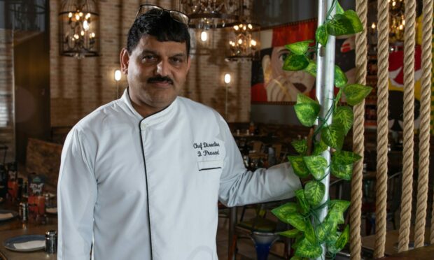 Prasad in his chef outfit inside Dhoom Indian Streatery in Dunfermline.