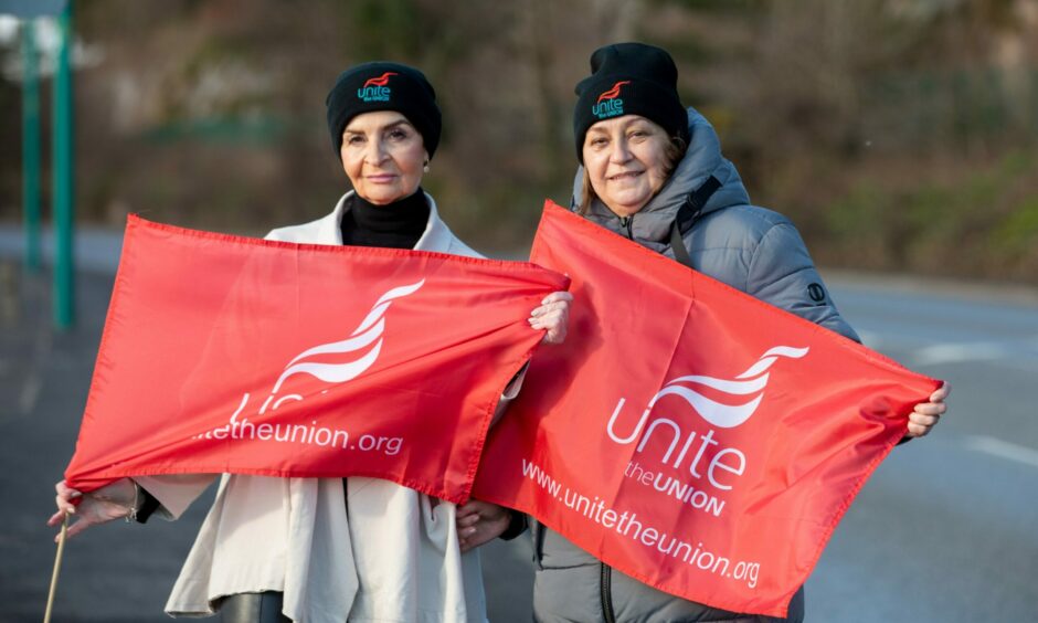 Airport security staff Sonia Molinari and Michelle Dye at the Dundee Airport strikes. They hold Unite the Union flags at the picket line.