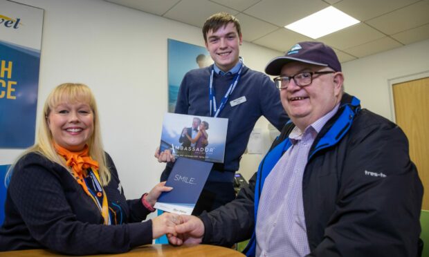 Iain Thom (right) alongside Vicky Wilson and Lewis Banks from Hays Travel Broughty Ferry. Image: Kim Cessford / DC Thomson