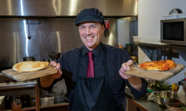 Panzerotti Cafe and Bakery owner Sandro Tato serving up fresh panzerotti.