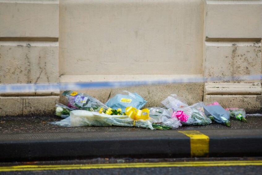 Floral tributes after fire at new county hotel in perth