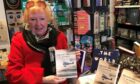 Margaret Bowman at The Bookhouse. Broughty Ferry with her book, The Lost Airfields of Angus. Image: Margaret Bowman