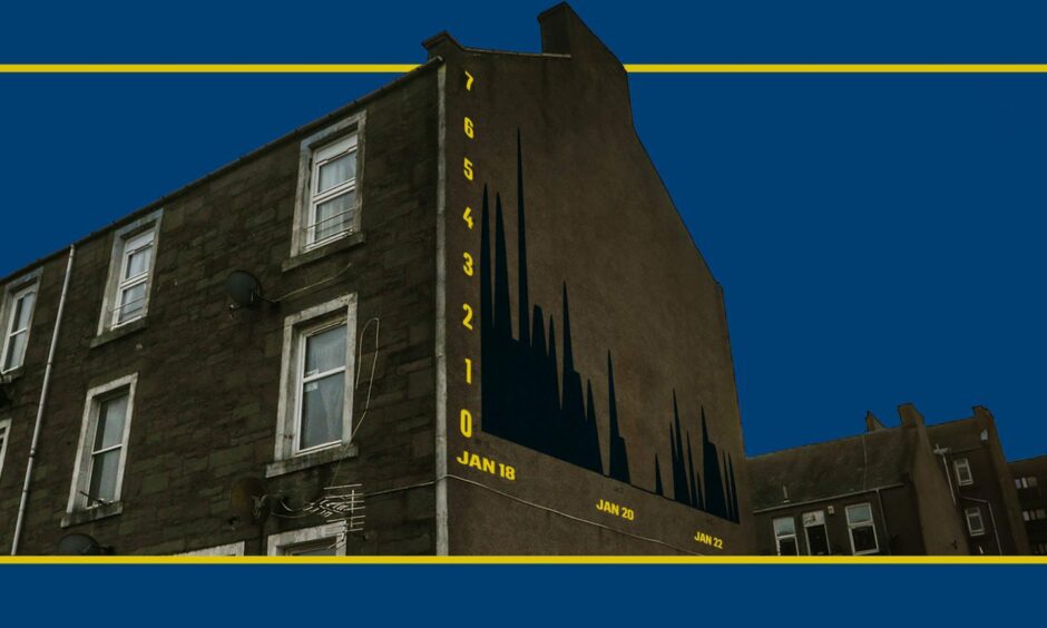 A residential building in Dundee in need of housing repairs with a data chart on the side of the building.