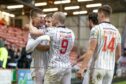 Th Dunfermline players celebrate Breen's opener. Image: Craig Brown.