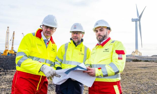 SGN chief executive Mark Wild OBE (centre) with Andy Colquhoun and Stephen Cunniffe from Altrad Babcock. Image: SGN.