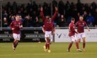 Toyosi Olusanya celebrates his late strike for Arbroath at Cove Rangers. Image: Darrell Benns / DCT Media