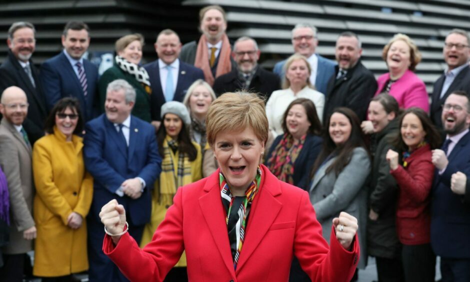 First Minister Nicola Sturgeon with the SNP's newly elected MPs outside the V&amp;A Museum in Dundee in 2019