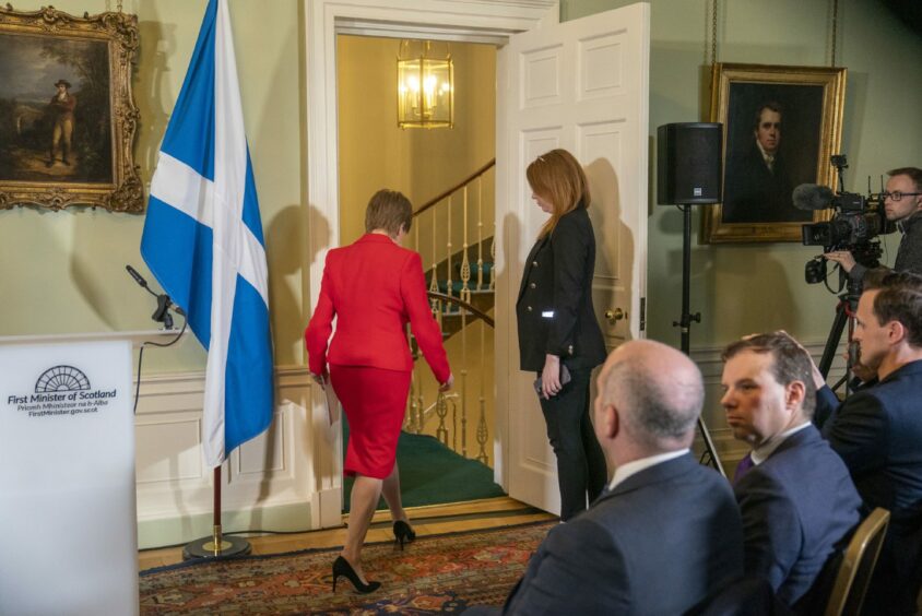 Nicola Sturgeon walks out of the press conference in Bute House where she announced she was stepping down as First Minister.