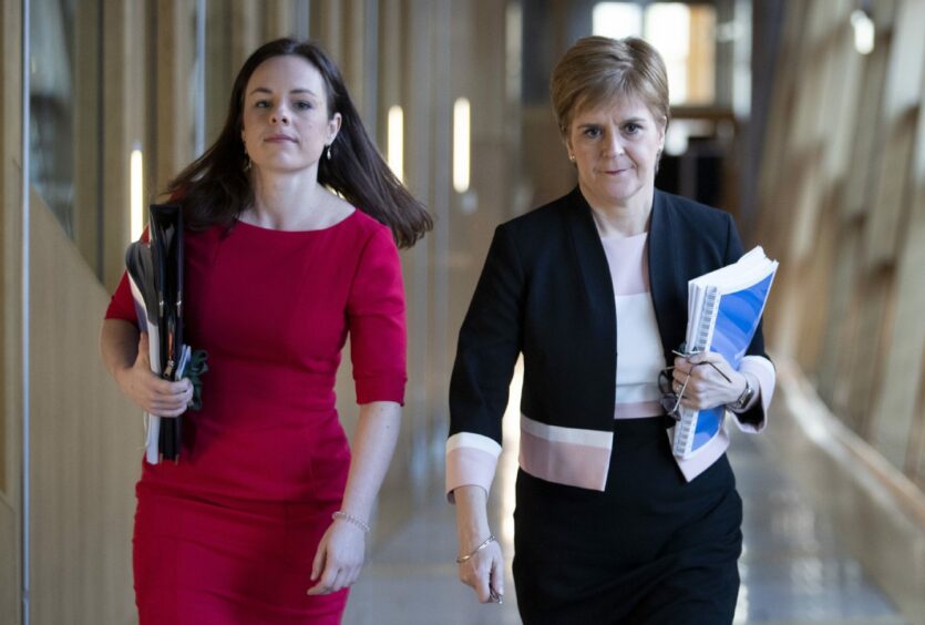 Kate Forbes and Nicola Sturgeon in the Scottish Parliamenr
