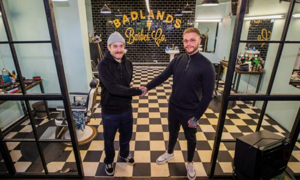 Grant George of Badlands Barber with Brandon Mundo, who is moving his business Deadset Studios into the shop. Image: Steve MacDougall/DC Thomson
