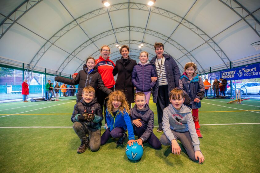 Eilidh Barbour (back centre) alongside Alison Chapman (Active Schools, back left) and Royal School of Dunkeld headteacher Nicola Williams (back right) and local children
