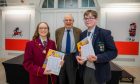 This year's gold medal winners Kate Mathieson (Harris Academy) and Matthew Jamieson (High School of Dundee) alongside  Mr Andrew Thomson. Image: Steve MacDougall/DC Thomson.