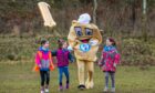 Loons mascot Baxter the Bridie joins in the birthday fun Freya 7, Holly, 5, and Izzy, 7, at Forfar Loch. Image: Steve MacDougall/DC Thomson