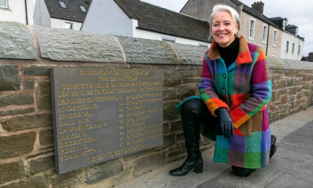 Gail Forbes, granddaughter of one of the men lost, alongside the new plaque. Image: Steve Brown/DC Thomson