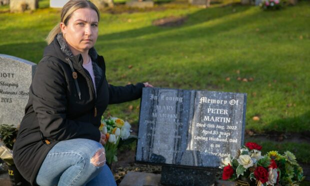 Rosyth resident Mary MacLeod at her grandparents' grave. Image: Steve Brown/DC Thomson.