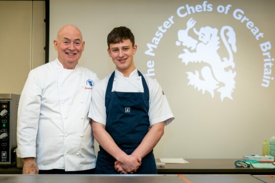 Master Chefs of Great Britain chair George McIvor and 17-year-old chef Connor Cameron at the Seafood Masterclass. Image: Steve Brown/DC Thomson