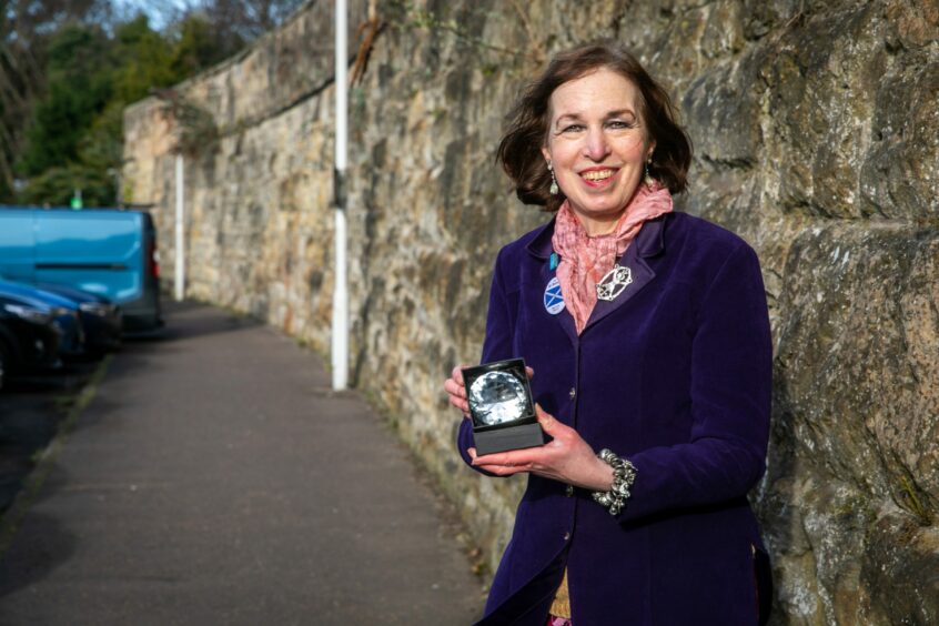 Jane Ann Liston with her Railfuture Campaigner of the Year award. 