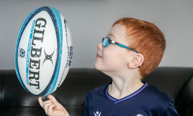 Taylor Dryburgh, 5, showing his love for rugby.