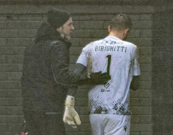 Dundee United goalkeeper Mark Birighitti was substituted clutching his shoulder after his moment of madness against St Johnstone.