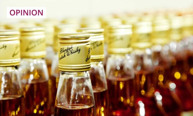 production line of Scotch whisky bottles.