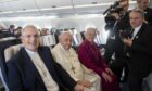The Right Rev Dr Iain Greenshields with Pope Francis and Archbishop of Canterbury Justin Welby aboard the Papal plane.