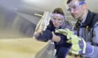 Two people completing an apprenticeship. Apprenticeships in Scotland are some of the best there is.