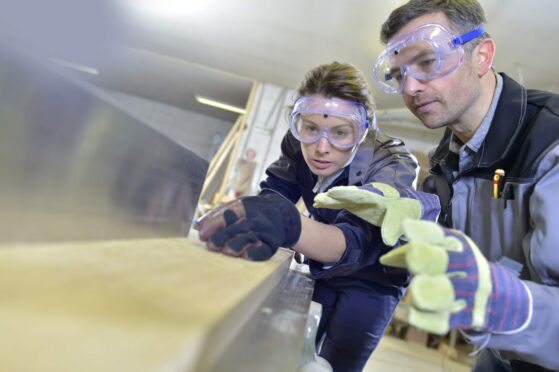 Two people completing an apprenticeship. Apprenticeships in Scotland are some of the best there is.