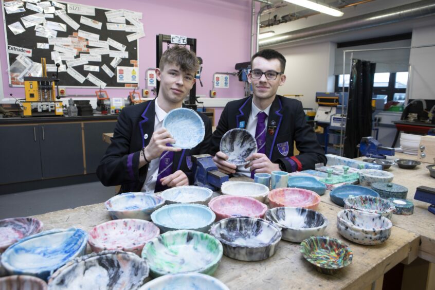 St John's Academy pupils Noah Law and Diesel Ferguson with some of the bowls they have made as part of the project.