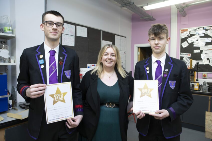St John's Academy pupils Diesel Ferguson (left) and Noah Ferguson with tech teacher Johann Packer, who nominated them for the Gold Star. 