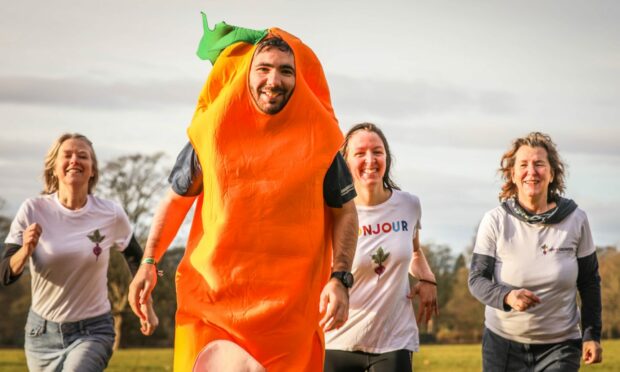 Members of the Campy Growers group running Camperdown's park run on Saturday morning to promote their bid for the Dundee Climate Fund. Image: Mhairi Edwards/DC Thomson