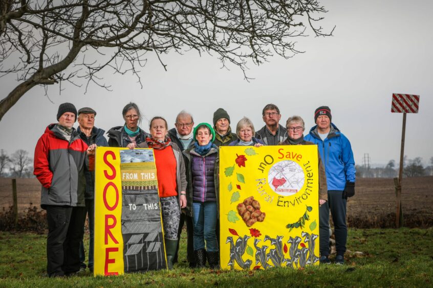 Members of the Save Our Rural Environment (SORE) group with placards and banners