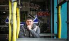 Steven McCafferty outside Scottish Barbers on Strathmartine Road. Image: Mhairi Edwards/DC Thomson
