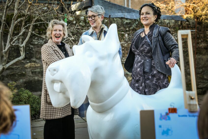 Louise Fraser from BID St Andrews, centre, with Annie Long, fundraising manager for Maggie's Dundee, right, and artist co-ordinator Rio Moore. 