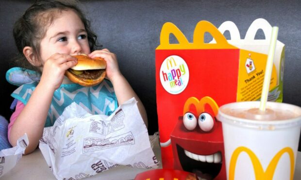 The petitioner says children go "wild" for promotions at fast food restaurants. Image: Shutterstock/ChameleonsEye.