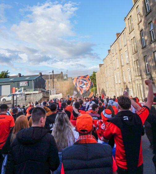 large crowd of Dundee United fans outside the club's stadium.