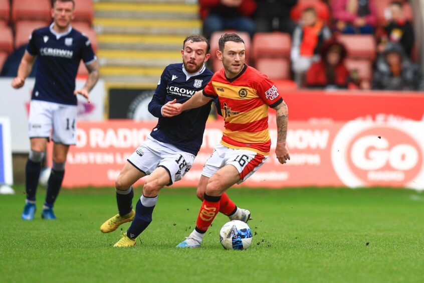 Paul McMullan challenges Lee Hodson at Firhill