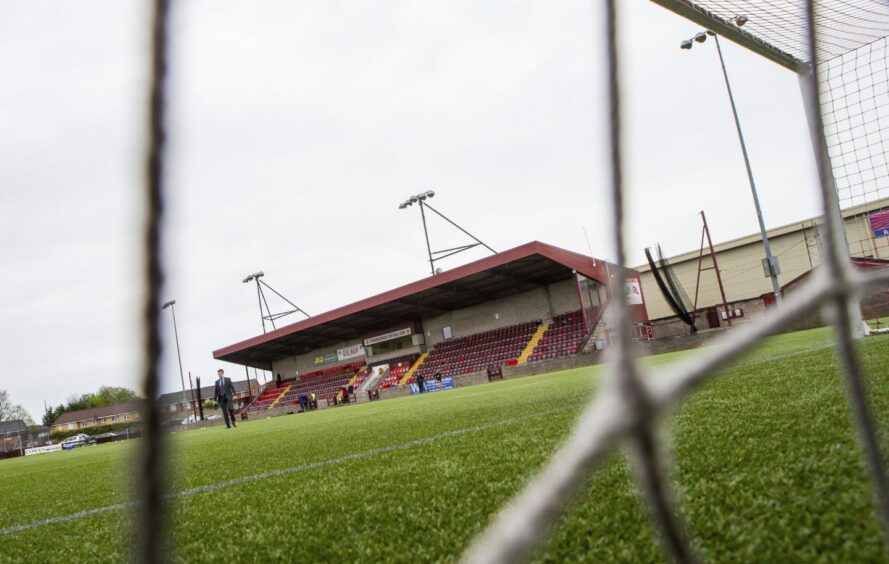 A shot of Ochilview Park, taken from behind the goal and looking out at the pitch through the net. Image: SNS.